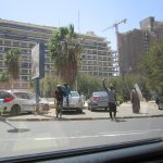 Place de lIndépendance a Dakar, immeubles du Plateau et rue animee